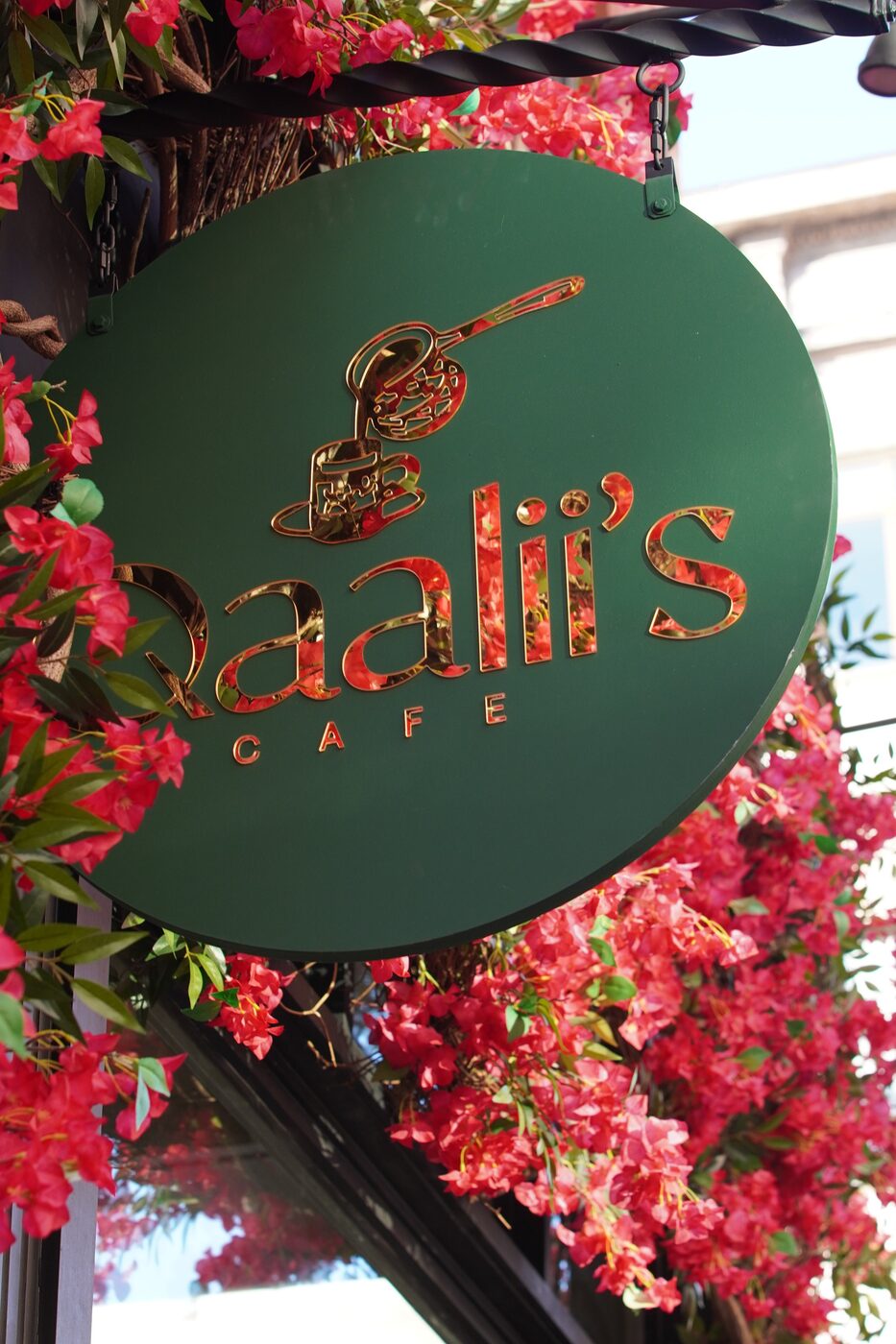 Ral's Cafe sign with pink flowers